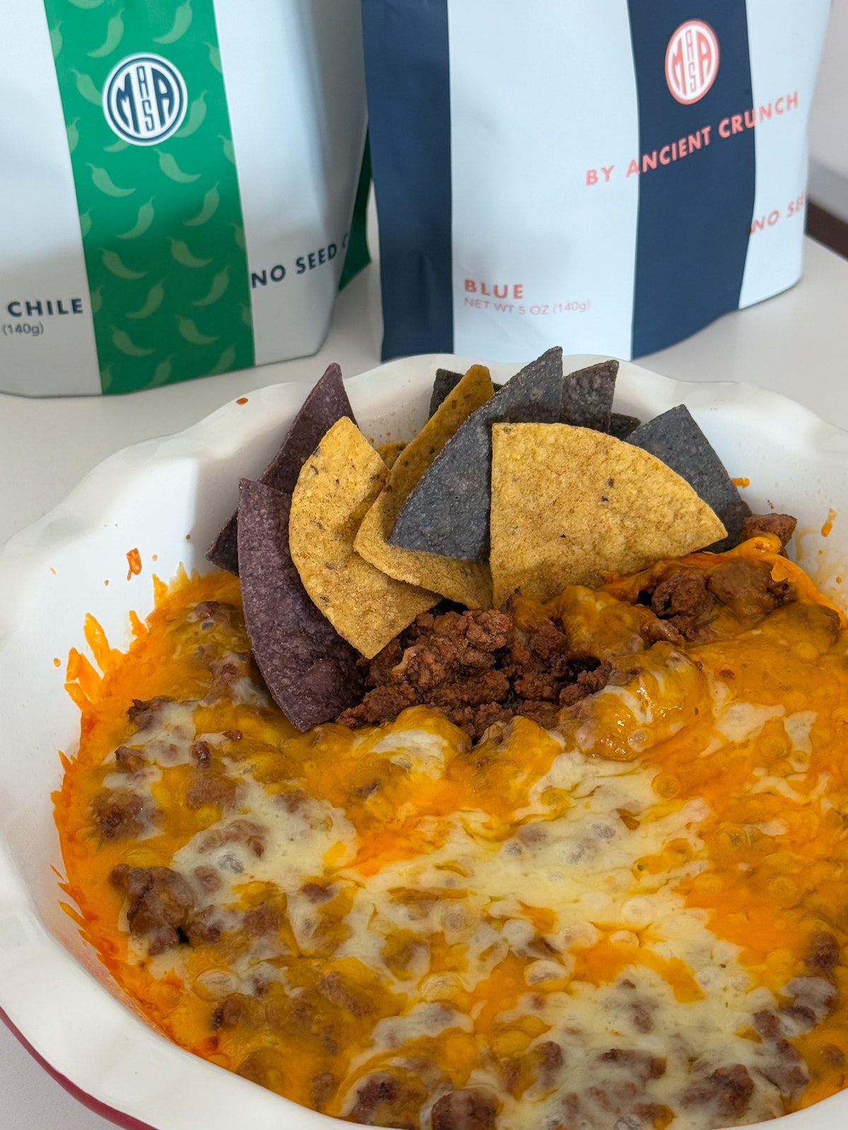 Healthy Skyline Chili Dip which pairs the melty, bubbling cheddar with MASA Chips