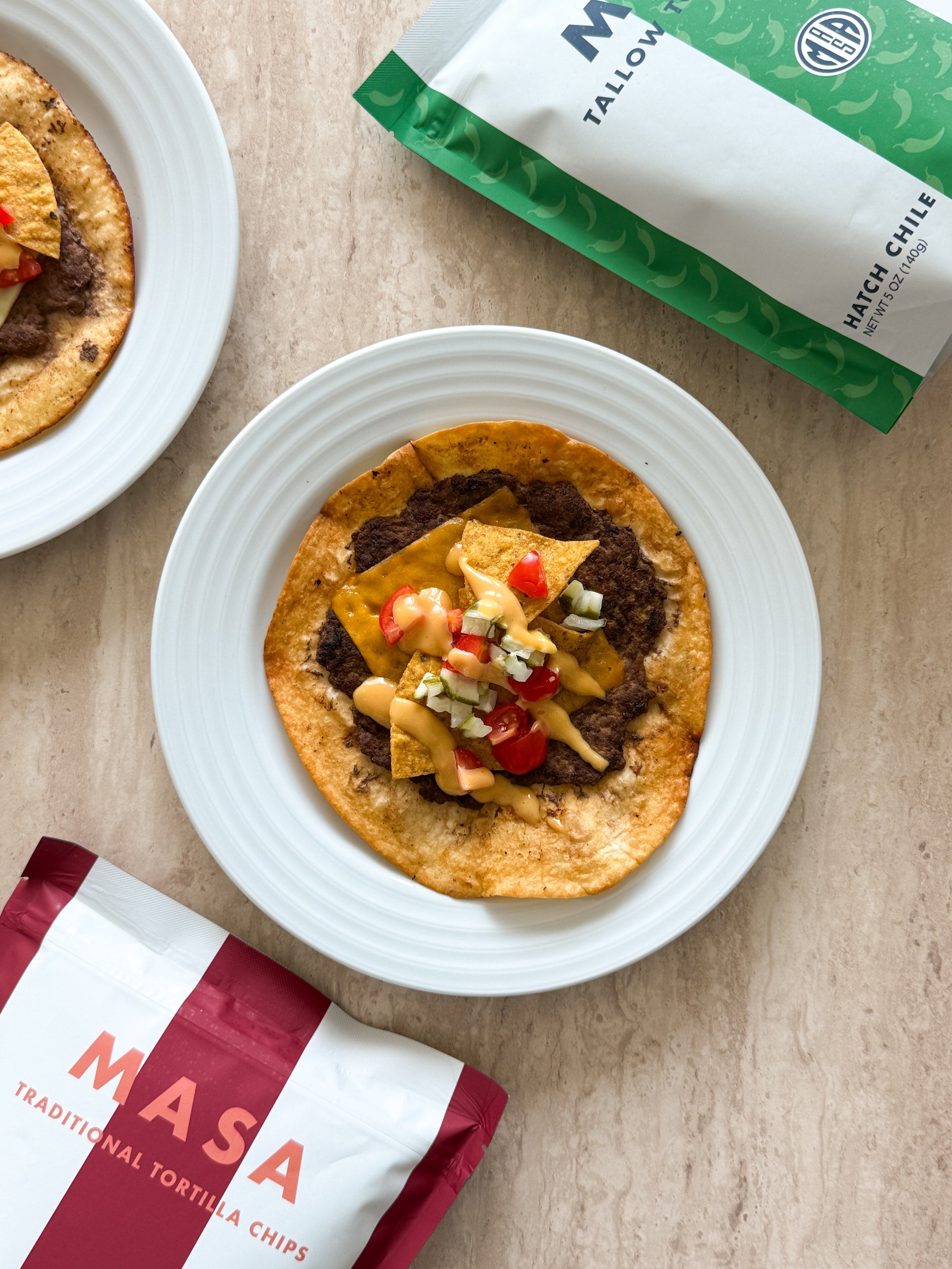 Juicy seasoned beef smashed on a tortilla, melted cheese, and a crunchy layer of spicy MASA Chips.