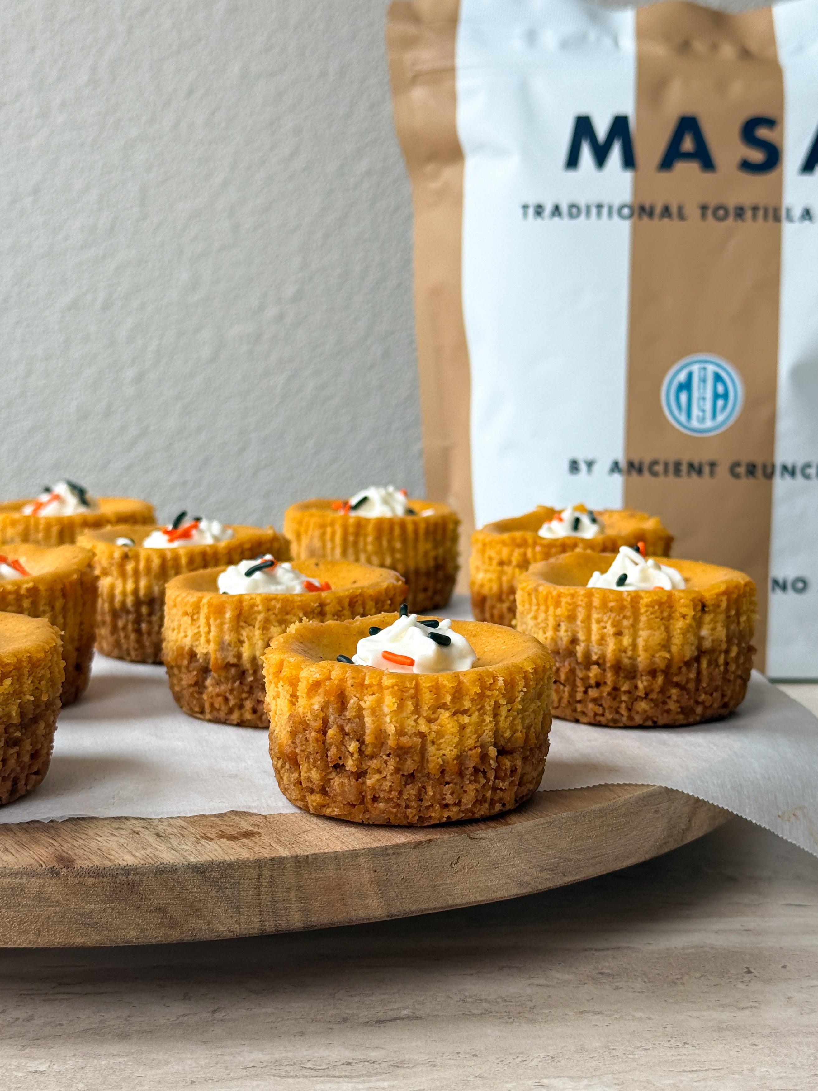 These individual mini pumpkin cheesecakes feature a velvety spiced filling baked over a crisp, cinnamon-sugar crust made from crushed beef tallow Churro MASA chips.