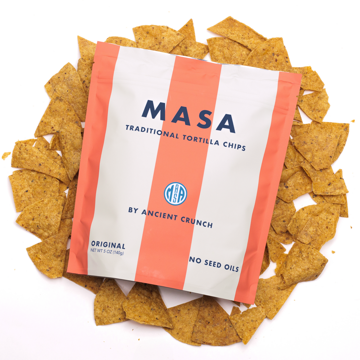 A bag of MASA Original lying on a pile of tortilla chips