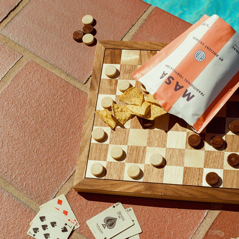 MASA Original chips and bag on a checkerboard beside a pool